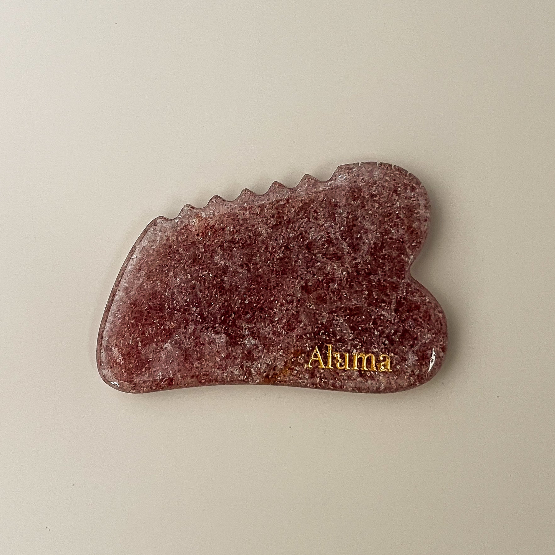 Aluma Ori gua sha i strawberry quartz.